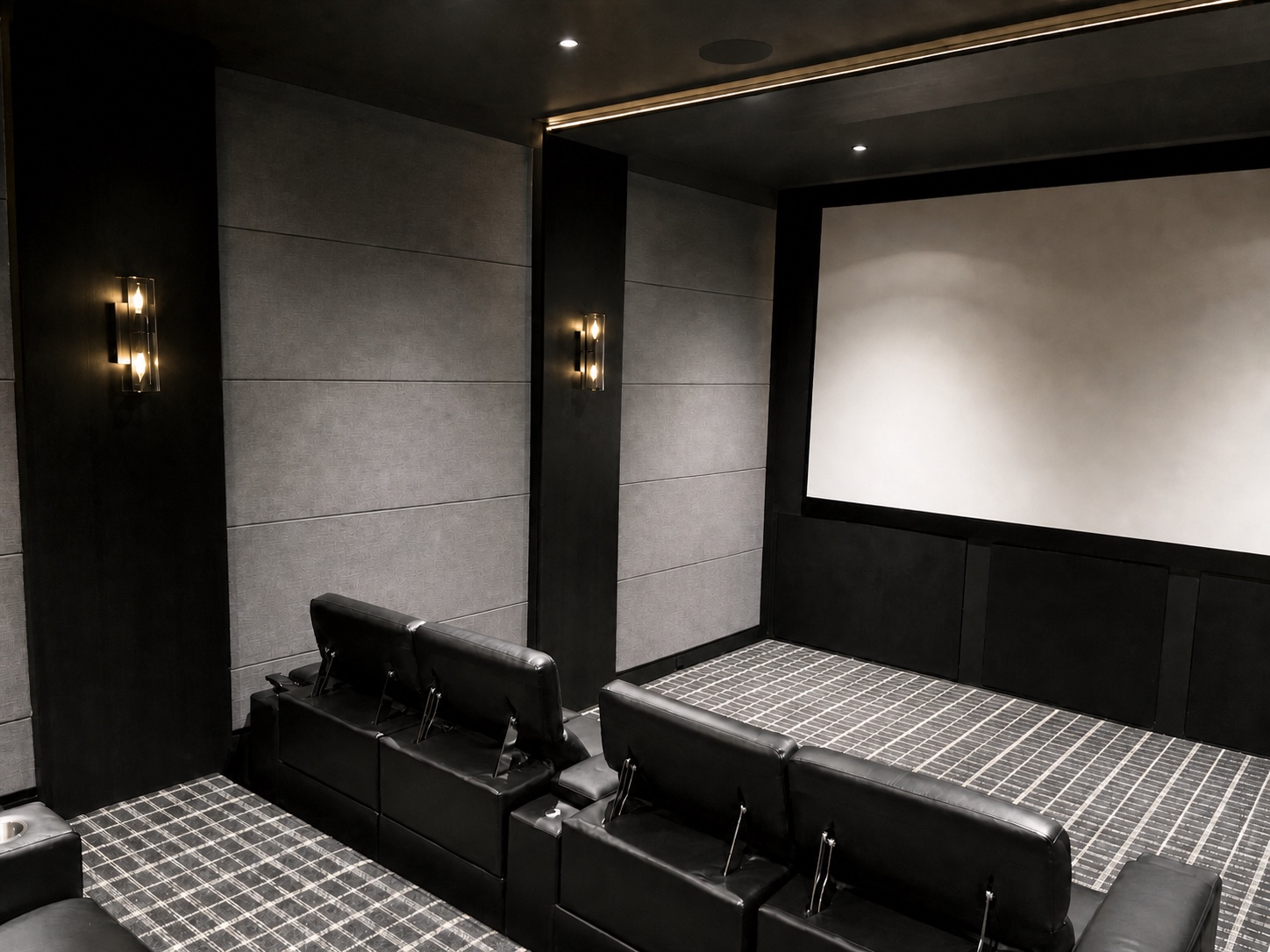 Projection screen and seating viewed from the rear of the theater