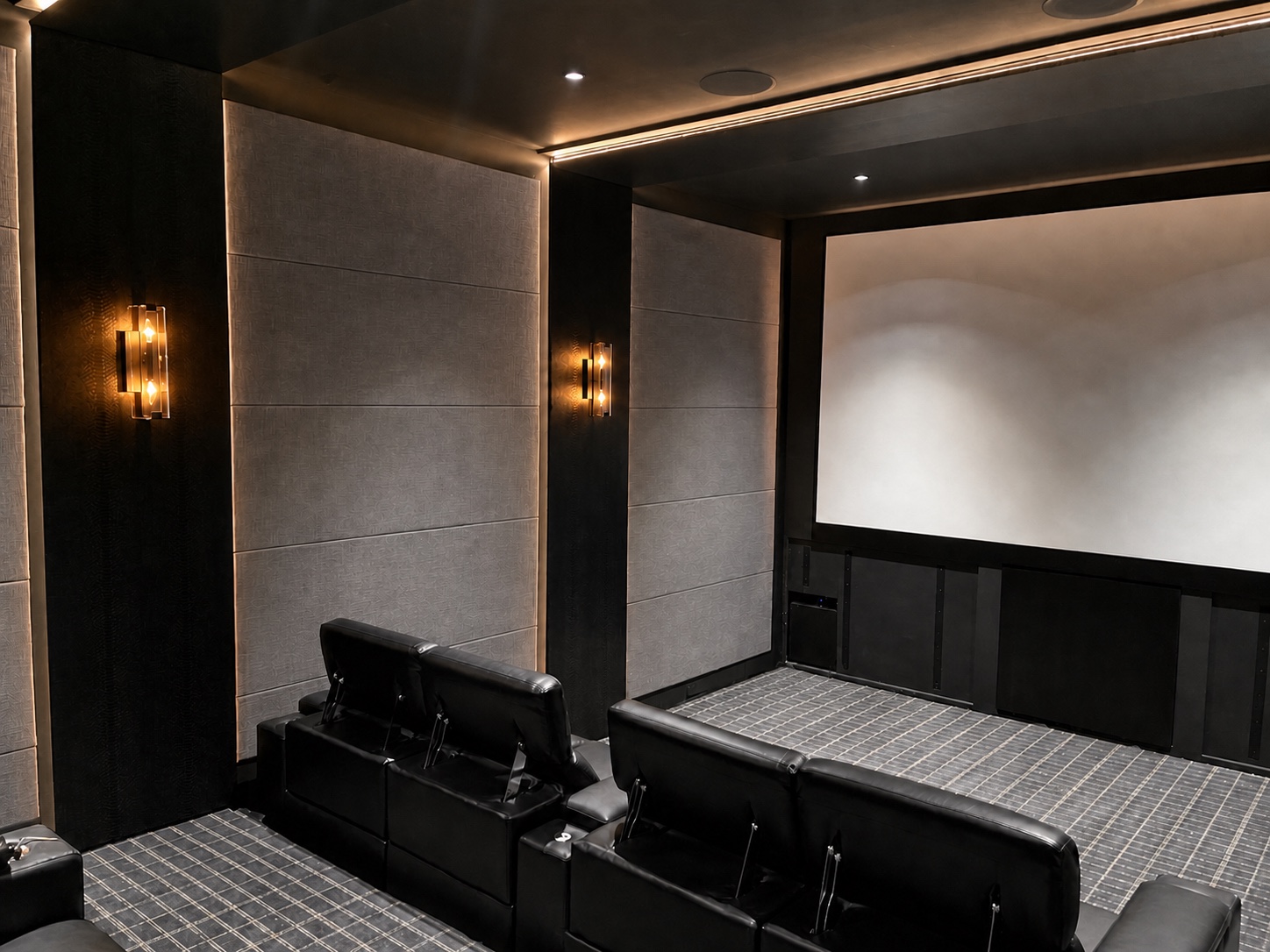 Projection screen wall with concealed speakers and acoustic treatments