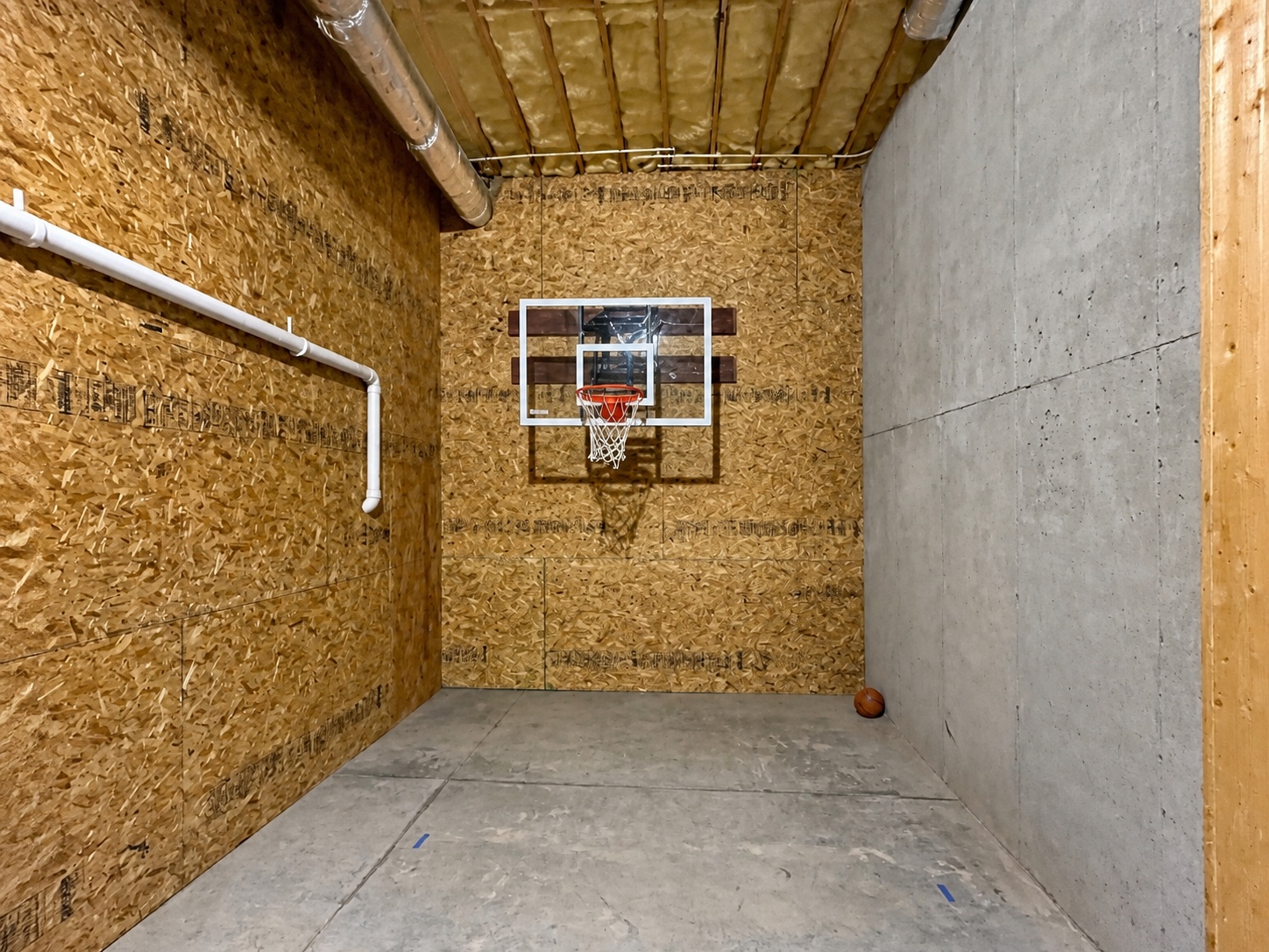Unfinished Hickory room before custom home theater construction