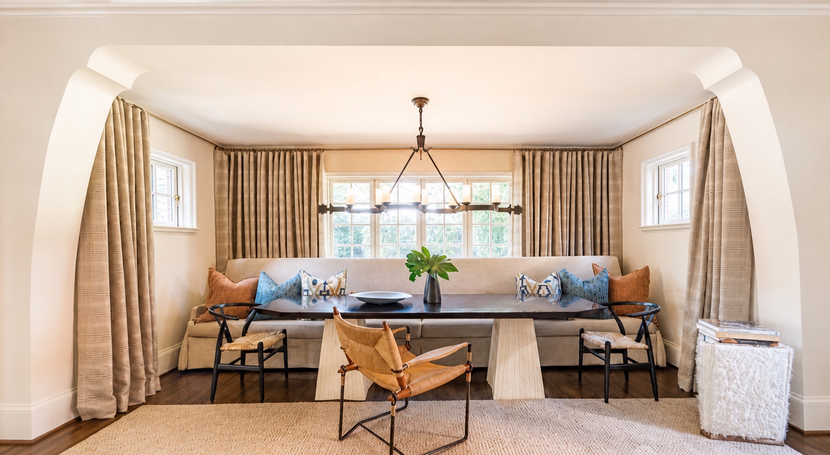 Breakfast room with tailored drapery and architectural lighting