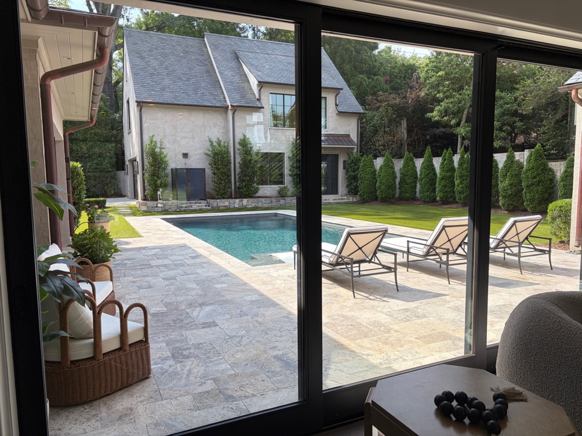 Sliding glass doors overlooking the Eastover residence pool