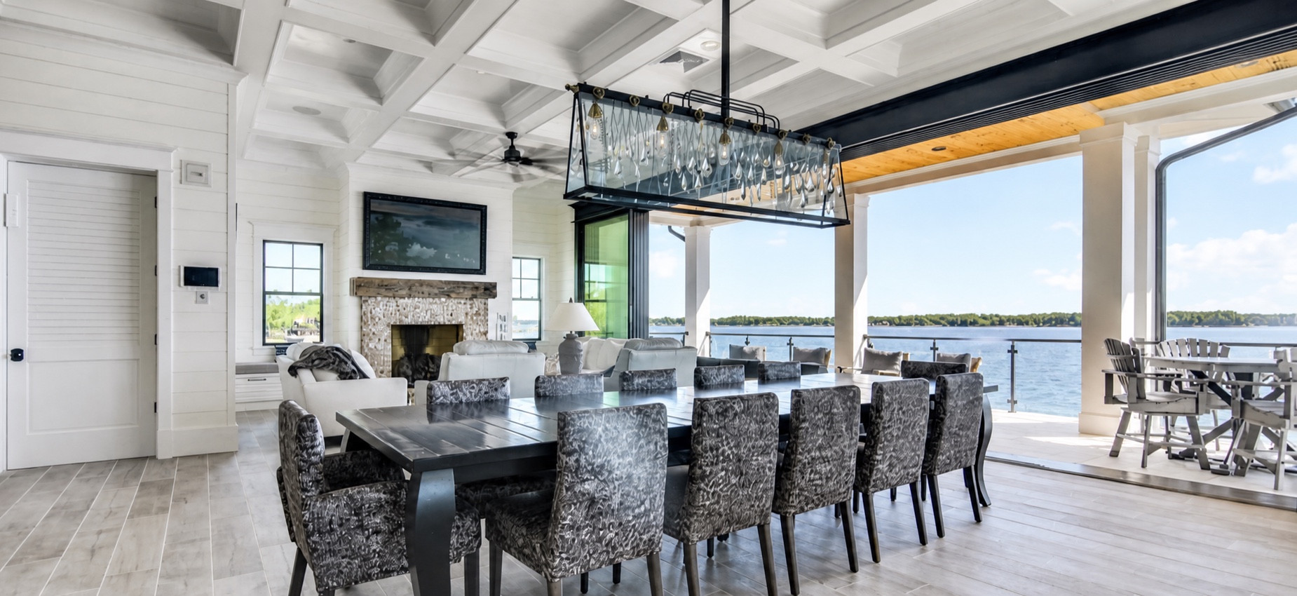 Dining and living spaces opening to the lake