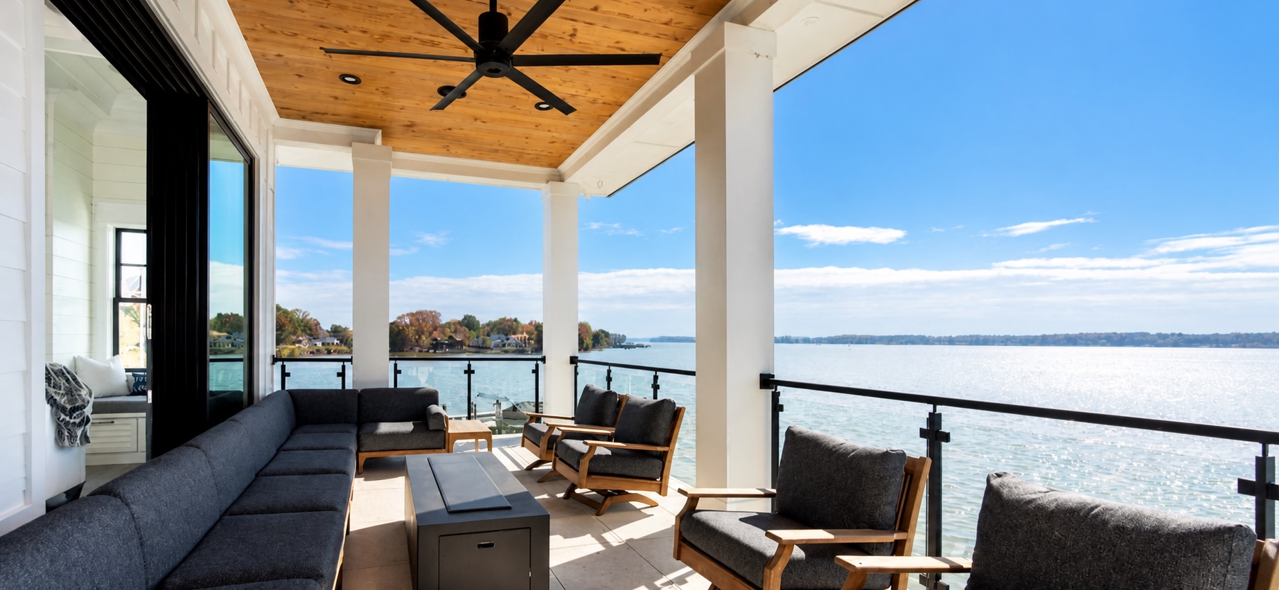 Covered lakefront terrace with discreet audio and lighting