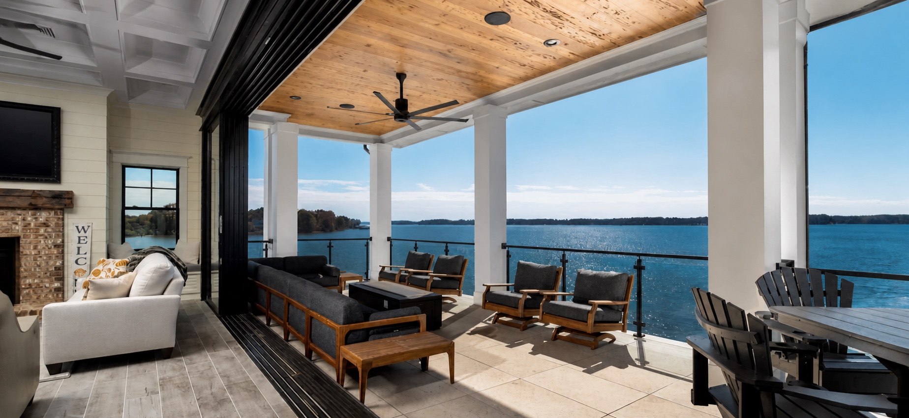 Indoor and outdoor living spaces connected by an operable glass wall