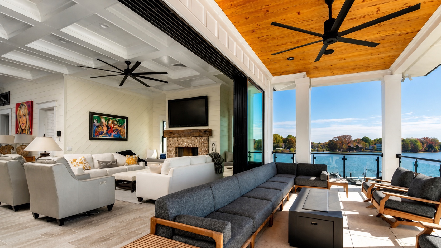 Lakefront great room opening to a covered terrace