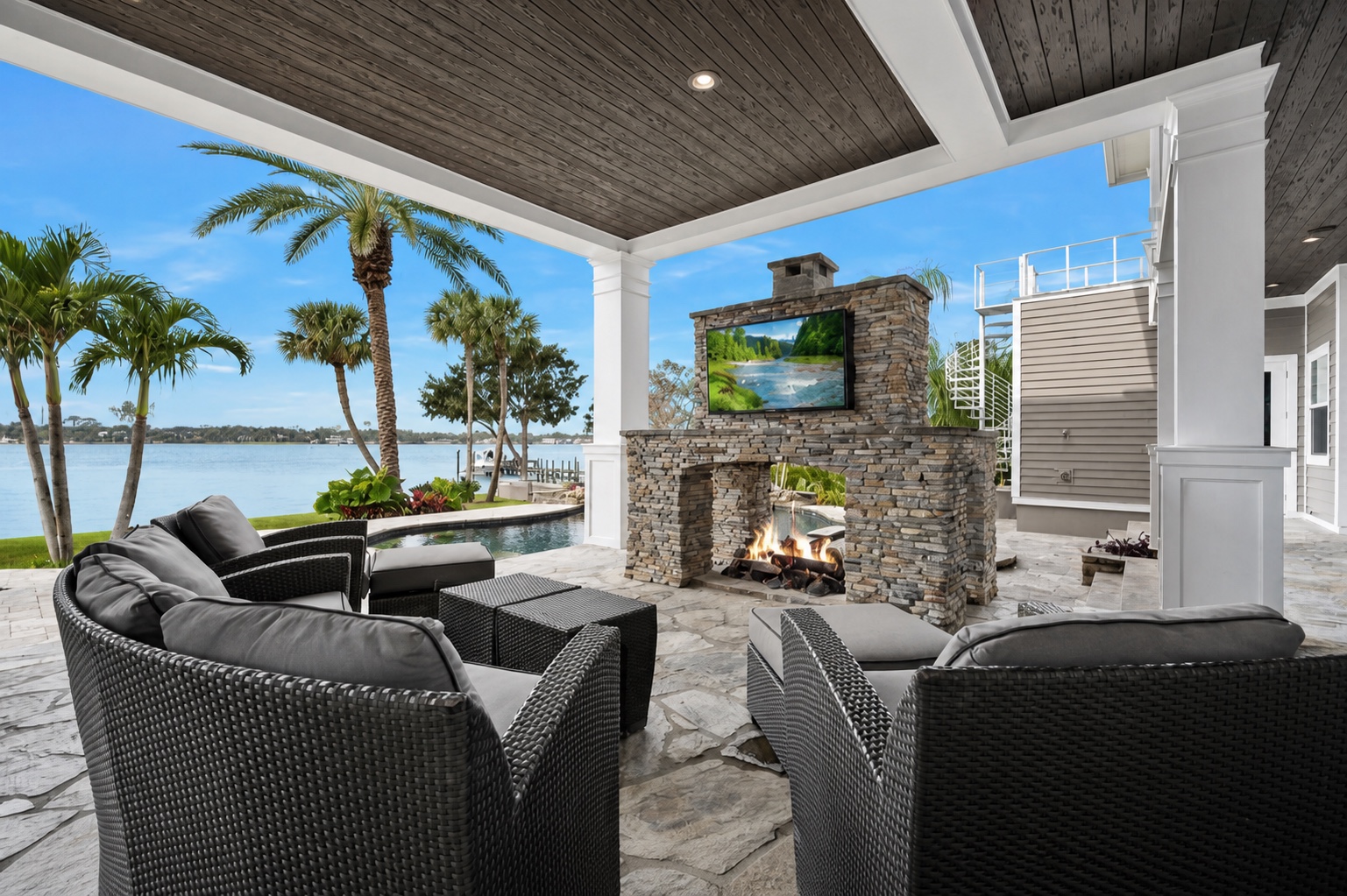 Covered Ormond Beach waterfront living area with an integrated television