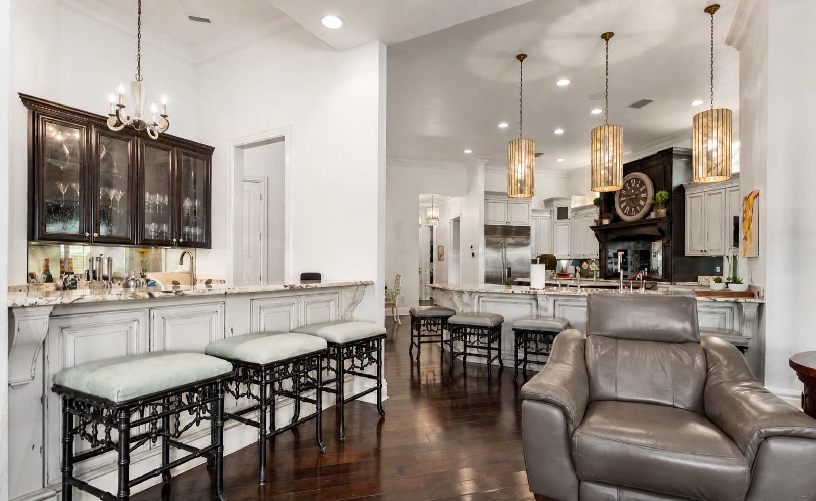 Kitchen and bar area with layered lighting