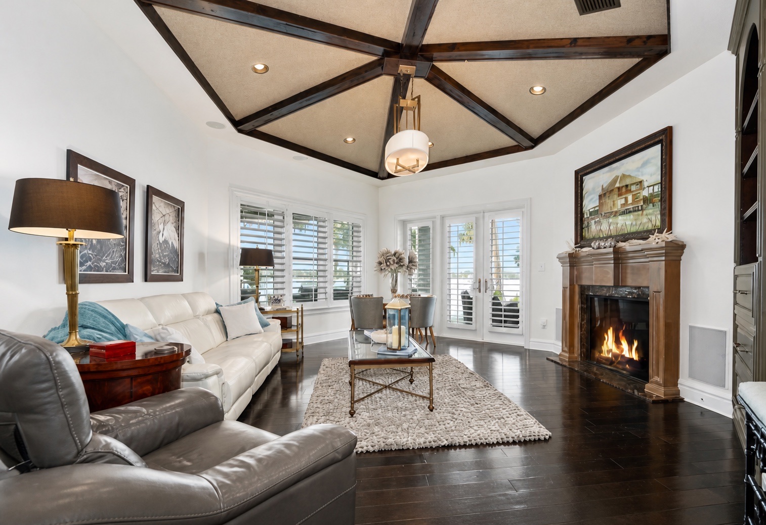 Waterfront living room with fireplace and integrated audio