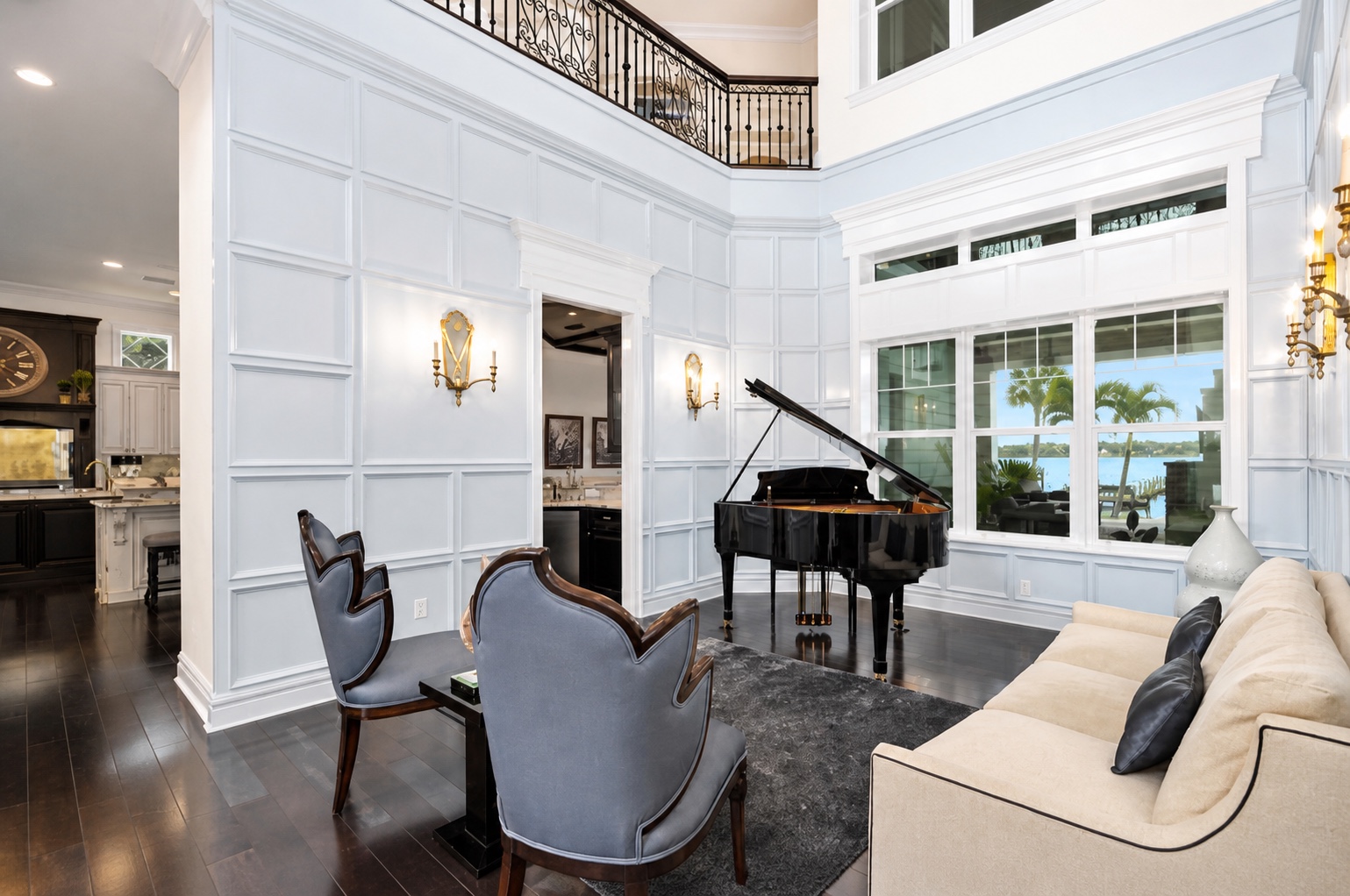 Two-story music room with grand piano and integrated lighting