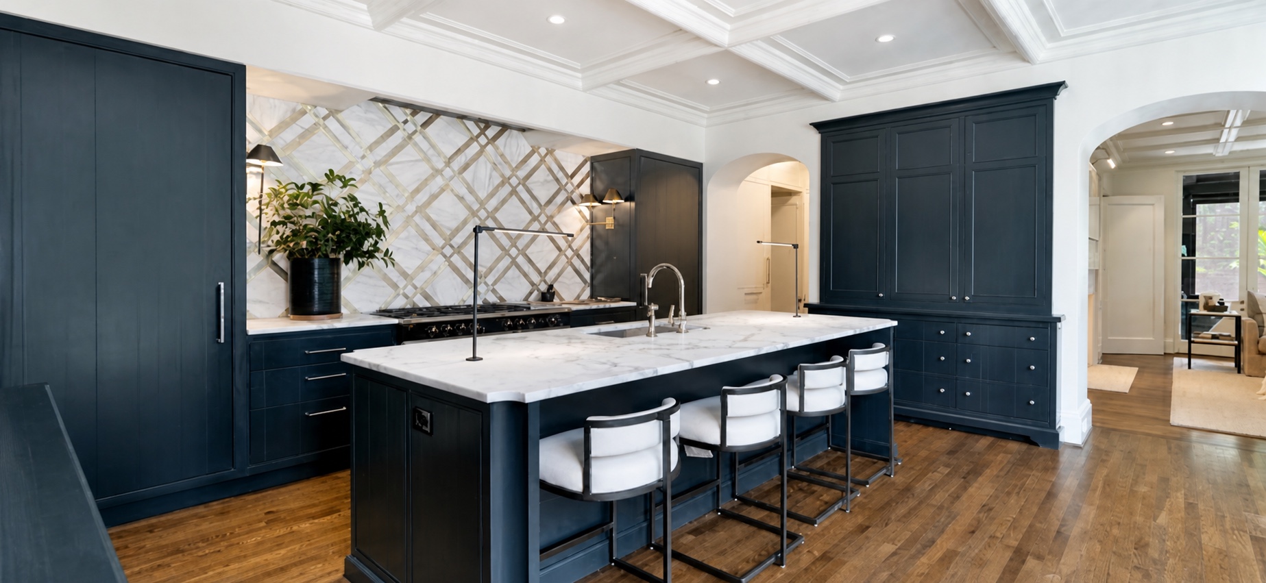 Renovated Dilworth kitchen with dark cabinetry and discreet lighting