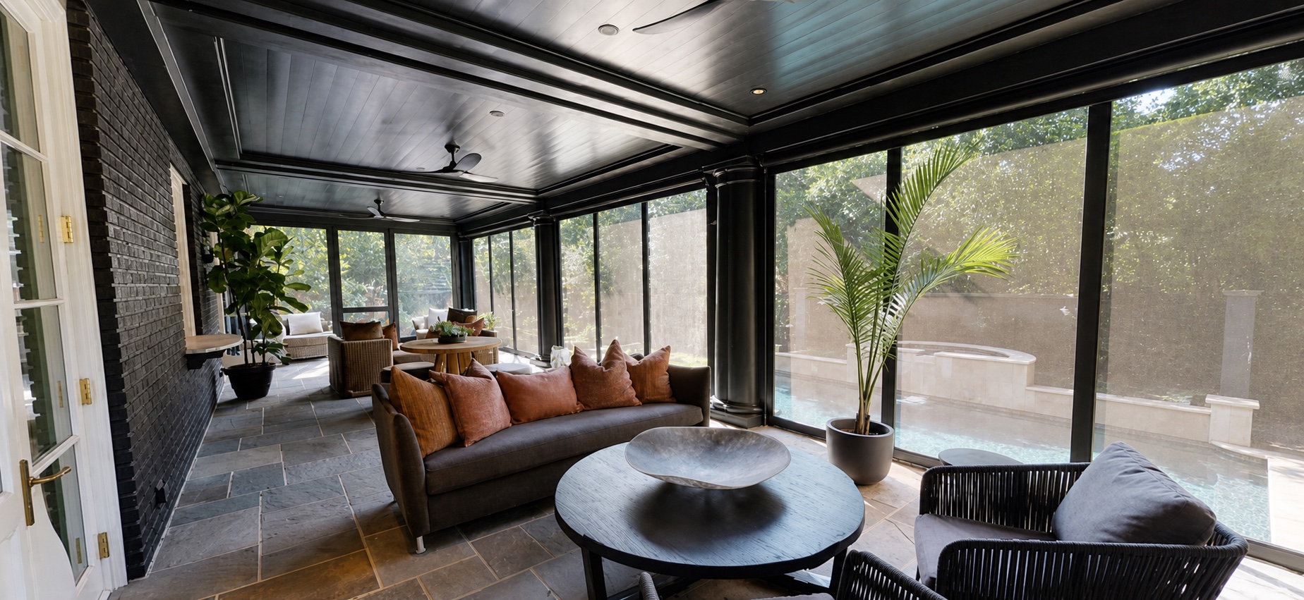 Screened porch with integrated lighting and views of the pool