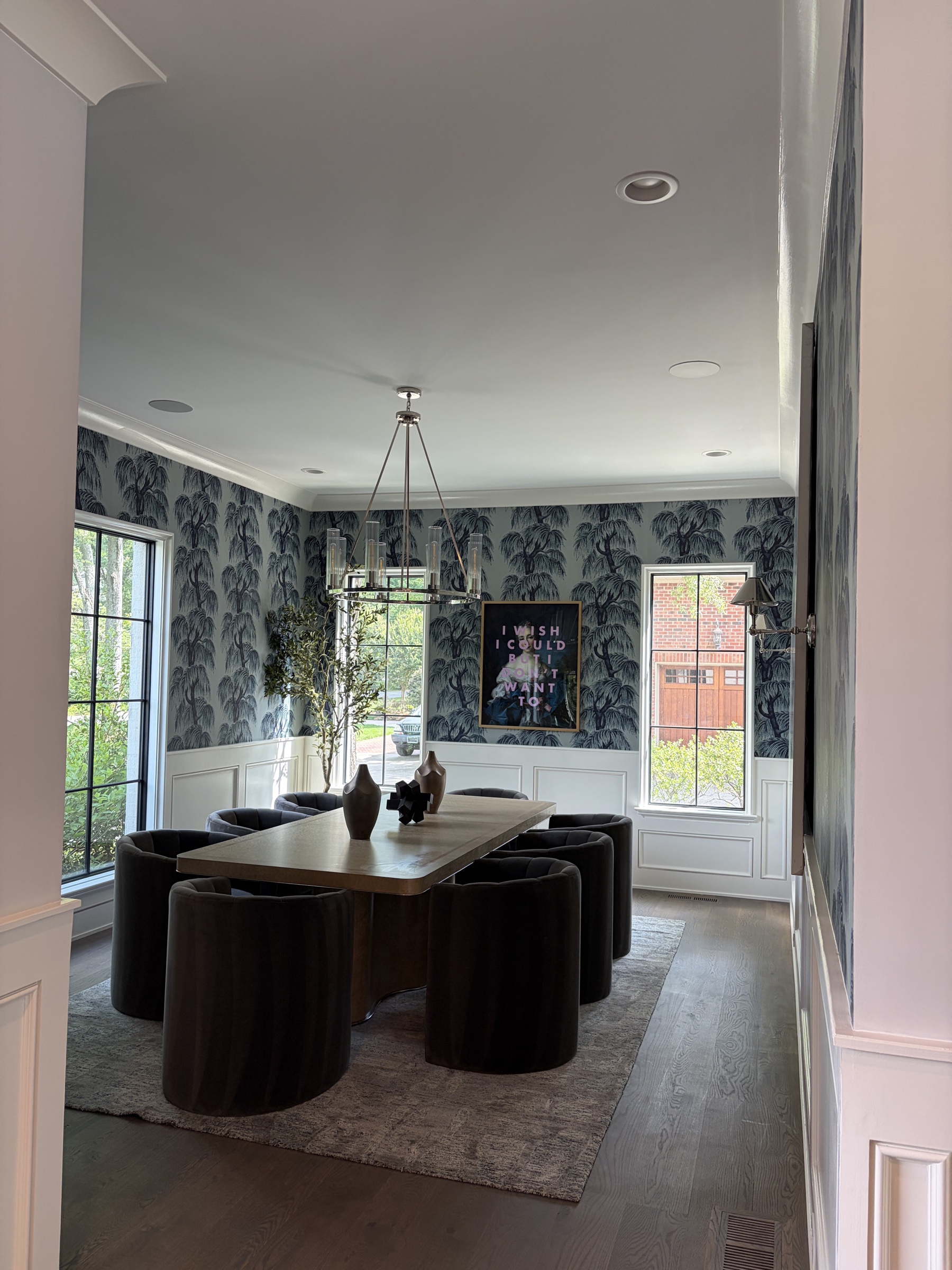 Formal dining room with patterned wallcovering and integrated in-ceiling audio