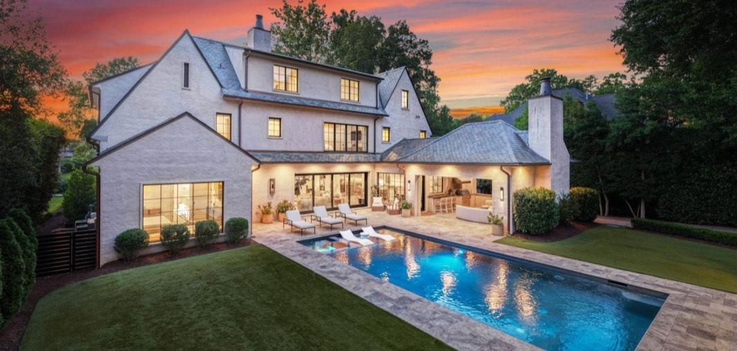 Eastover residence rear exterior and pool at sunset